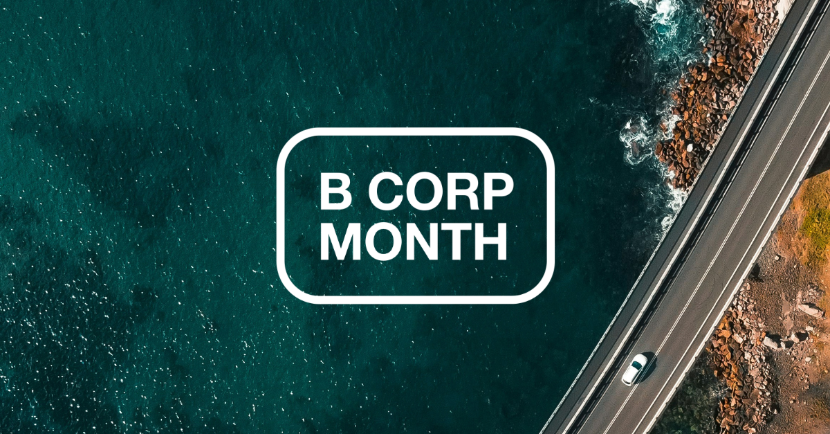 White text reads B Corp month. Aerial view of a coastal road with a car driving along the ocean.